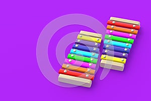 Colorful xylophones on purple background. Kids toy. Preschool education. Musical instrument