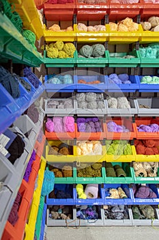 Colorful yarn balls on the shelf.