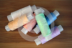 Colorful yarn on spool  cotton. Colorful sewing threads on white background