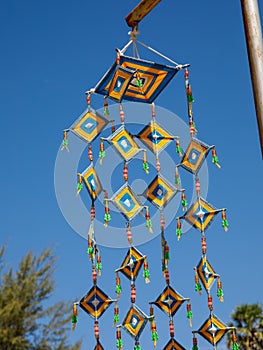 Colorful yellow blue spider web flag of Thai local traditional Buddhist belief