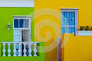 Colorful yellow and green facade of old house in Bo Kaap area