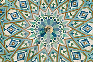 Colorful zellige tiles of a fountain in Morocco. Moroccan Mosaic pattern, traditional Islamic geometric design. Moroccan craft,