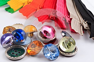 Colorful zippers, pencils and buttons.