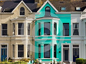 Colorfulhouses green blue yellow and red in row in Bangor Northern Ireland Aerial view