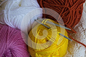Colorfull knitting yarn balls and needles