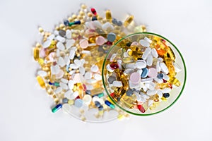 Colorfull medication and pills from above on white background