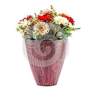 Colorfull plastic flowers in potery jar