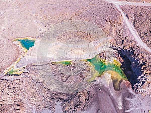 Colorfull ponds on Playa de Echentive on La Palma island. View from above