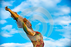 Colorfull womans body with colorful holi splash. Color festival.