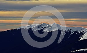 Colorfully clouds at sunset in top of the mountain on winter time at high altitudes