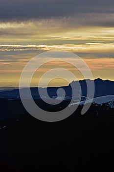 Colorfully clouds at sunset in top of the mountain on winter time at high altitudes