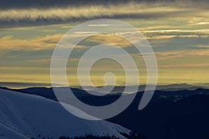 Colorfully clouds at sunset in top of the mountain on winter time at high altitudes