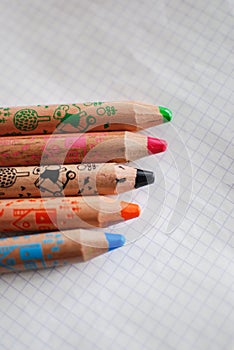 Coloring crayons on a piece of paper