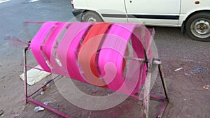 Coloring threads on manual spinning tool for Kite festival