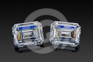 Colorless transparent sparkling set of two luxury gemstones square shape emerald cut diamonds on black background