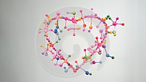 colors from atom of heart shape are dripping construction of molecular in heart shape