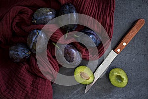 Colors of autumn. Still life with plums.