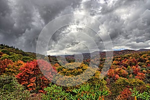 Colors in mountians in fall with clouds photo