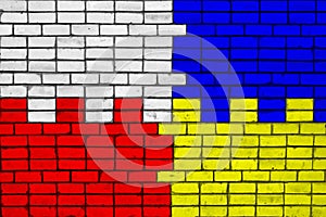 Colors of national flags of Poland and Ukraine on a brick wall