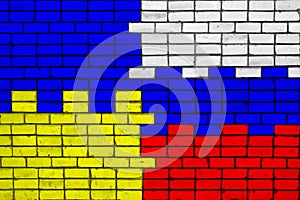 Colors of national flags of Ukraine and Russia on a brick wall