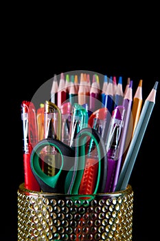 Colors pencil in glass with back background