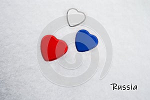 Colors of the russian flag White, Philippine Blue, Maximum Red painted on three hearts. photo