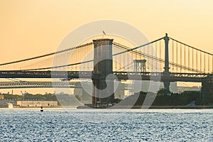 Colors of sunrise over Brooklyn Bridge, New York, USA