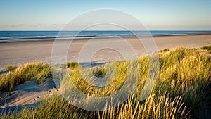 The sun is setting on the beach of Schiermonnikoog Friesland, Netherlands photo