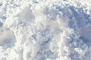 Colose up of pile of soft and fluffy white snow on bright sunny