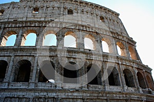 Coloseum against bright blue sky in Rome Italy