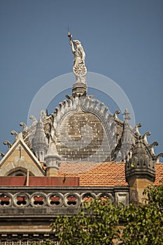 Colossal 5.03 metre structure of a lady atop the central dome Victoria Turminus Railway Station nowCSMT Railway Station a UNESCO w