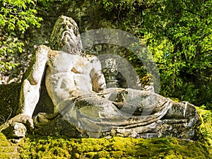 Colossal sculpture of god Neptune at famous Park of the Monsters, Bomarzo Gardens, province of Viterbo, Lazio, Italy