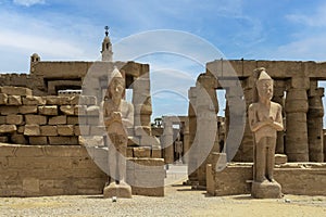 Colossal statues of Ramesses II flanking the west gate of the Ramesses II Court in the Luxor Temple, Egypt. photo