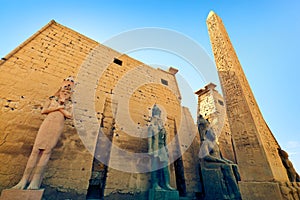 Colossal statues of Ramesses II in front of the main gate to Luxor Temple in Egypt