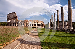 Colosseo and venus temple columns and path view from Roman forum