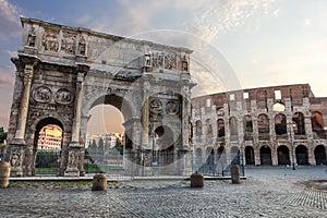 The Colosseum and The Arch of Constantine view with colorful sky and no people