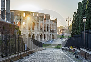 Colosseum (Coliseum) building and columns of Roman Forum, Rome, Italy