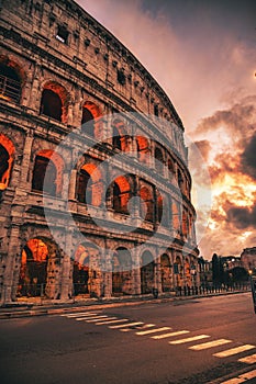 Colosseum illuminated with lights in the evening in Rome, Italy