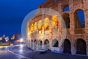 The Colosseum illuminated at night in Rome, Italy