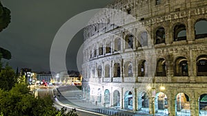 Colosseum illuminated at night timelapse hyperlapse in Rome, Italy