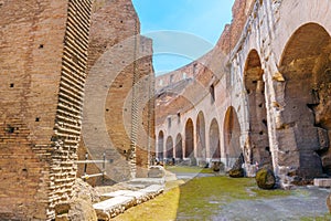 Colosseum interior passage on sunny day.
