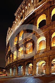 Colosseum, at night, landmark attraction in Rome - Italy