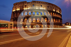 Colosseum, at night, landmark attraction in Rome - Italy