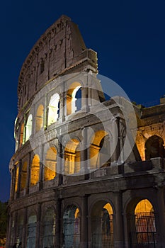 The Colosseum or Roman Coliseum at dusk, originally the Flavian Amphitheatre, an elliptical amphitheatre in the centre of the city