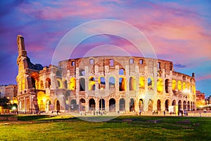 The Colosseum in Rome, Italy at colorful sunset twilight. The world famous colosseum landmark in Rome