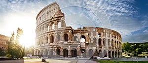 Colosseum in Rome and morning sun, Italy