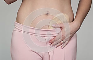 Colostomy pouch attached to patient - image