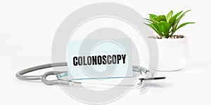 COLOSTOMY word on notebook,stethoscope and green plant