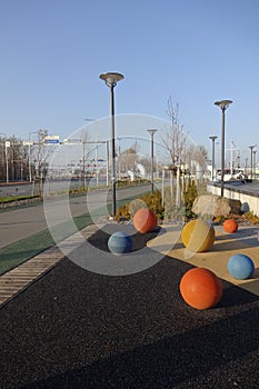 Colour balls on ground by the pedestrian walkway on Reidi promenade (Reidi tee in Estonian). Sea on the right, green