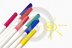 Colour felt-tip pens and sun